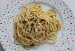 Creamy spaghetti with cockles and parsley