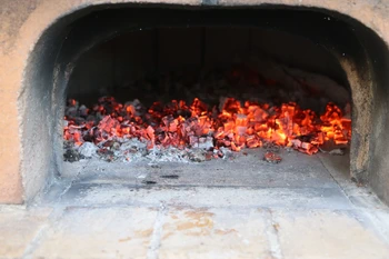 spreading embers on the baking stone