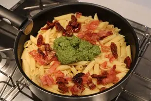 Pasta with pesto and preserved tomatoes