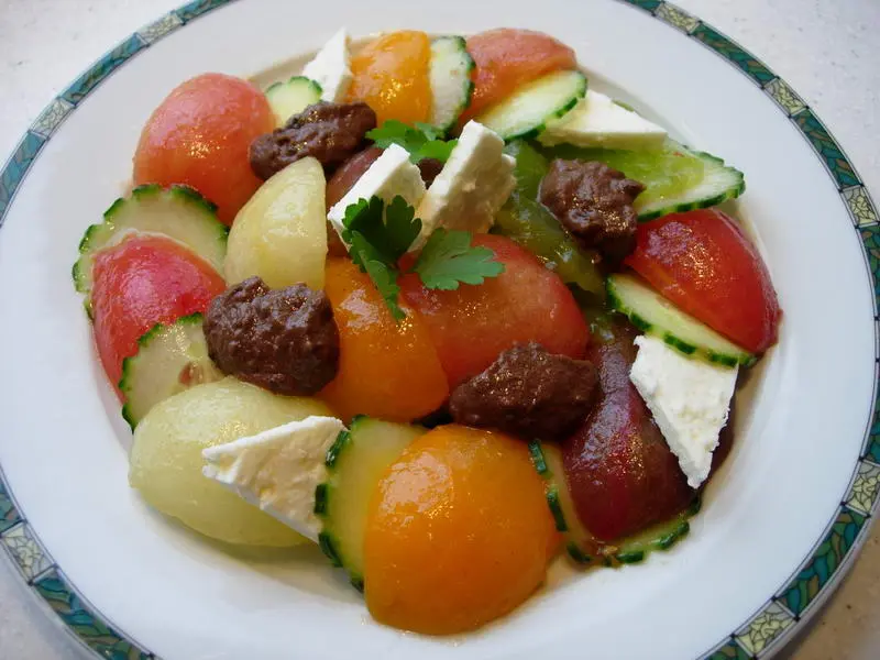 Multicoloured cucumber-tomato salad