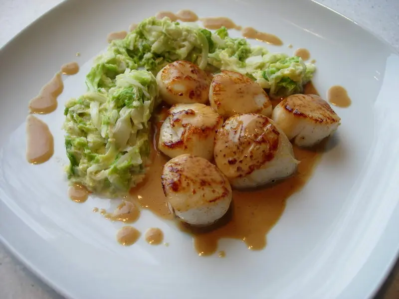 Scallops with cabbage julienne