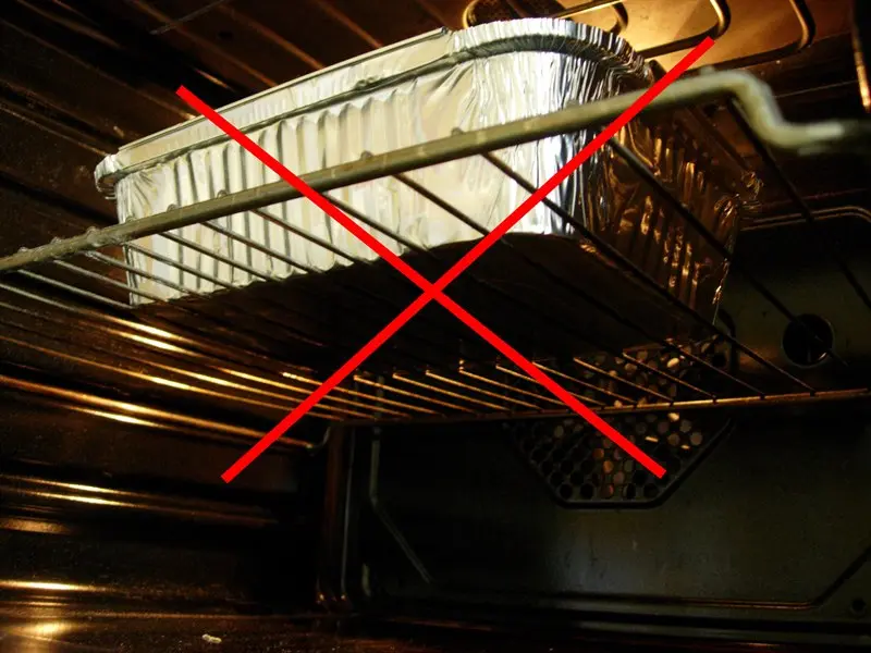 You should not put an aluminum container directly in the oven