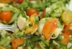 Cherry tomato salad, mixed greens, and Parmesan shavings