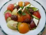 Multicoloured cucumber-tomato salad