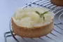 Coconut sweetcrust pastry, verbena-flavoured diplomat cream and pears poaches in a light syrup.