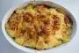 Potato gratin with lardons and onions, topped with cream and Époisses cheese.
