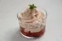 Strawberry mousse with mascarpone, served on a bed of fresh strawberries.