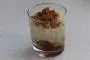 Verrine of caramelized apples in syrup, rice pudding and crunchy crumble topping.