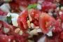 Tomato salad with feta and pine nuts.