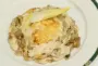 Thinly sliced ham endives au gratin with smoked cheese.