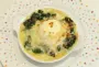 Soft-boiled eggs on a bed of spinach, topped with Mornay sauce au gratin.