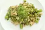 New peas and rice, served with pesto.