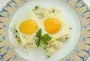 Creamy rice and fried eggs.