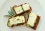 Grilled toast with layers of pesto, tomato, zucchini and feta.