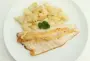 Sea bass fillets and Jerusalem artichokes grilled with lemon.