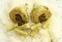 Artichoke bottoms garnished with a mixture of mint, parsley and garlic.