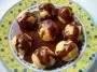 Choux filled with vanilla ice-cream and topped with chocolate sauce.