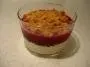 A layer of pannacotta , blackcurrant purée and crunchy crumble topping.