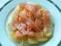 Fillet of salmon marinated in oil with carrots and onions.