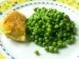 Chicken in a potato crust with peas.