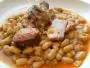 Slow-cooked casserole of dried whilte beans and different meats.