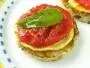 Fried buttered bread with pesto, omelette, cooked tomatoes and basil.