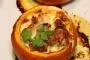Oven-baked pumpkins stuffed with a mixture of meats, chestnuts and cream.