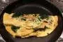 Omelette with lightly-fried spinach and shallots.