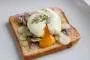 Lightly toasted bread, sardines, spring onion and poached egg.