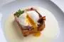 Pan-fried brioche, fried bacon, poached egg with cancoillote poured over.