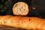 Like a short baguette but twisted, filled with diced goat's cheese and toasted walnuts.